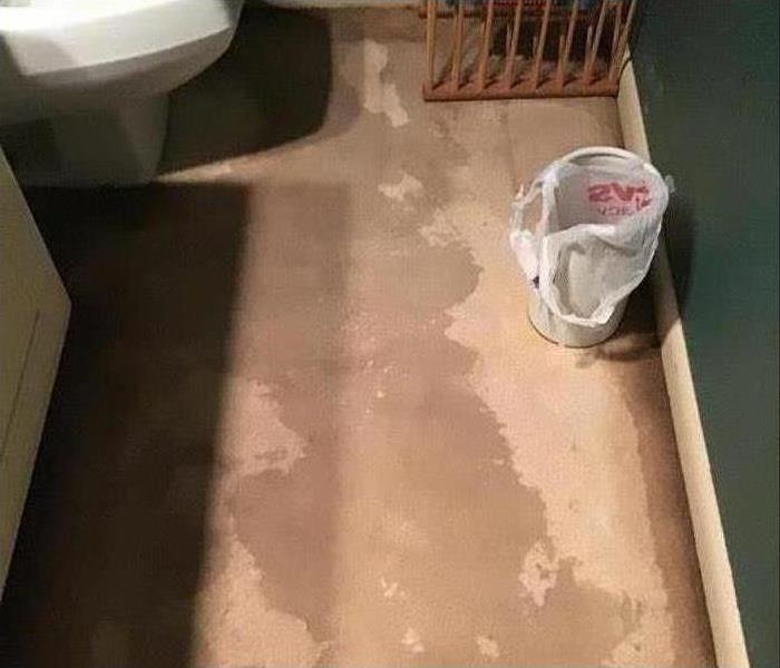 water damage on floor in bathroom