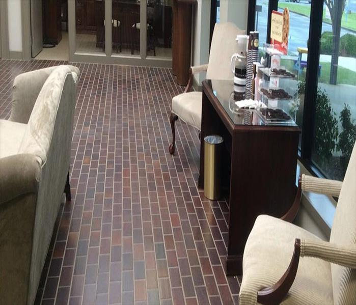 sofa, chair, coffee station, dry tile floor in a lobby