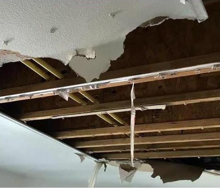 missing ceiling panels showing attic structure