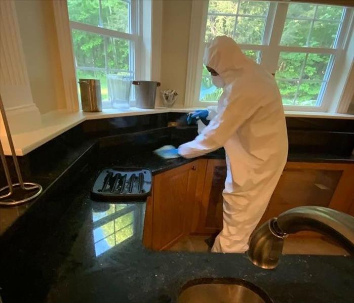 Cleaning and sanitizing a countertop following a loss