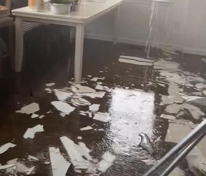 flood damage in a dining room with hardwood floors
